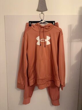Under Armour  orange Pullover Hoodie with straight leg loose fit jogger pants.